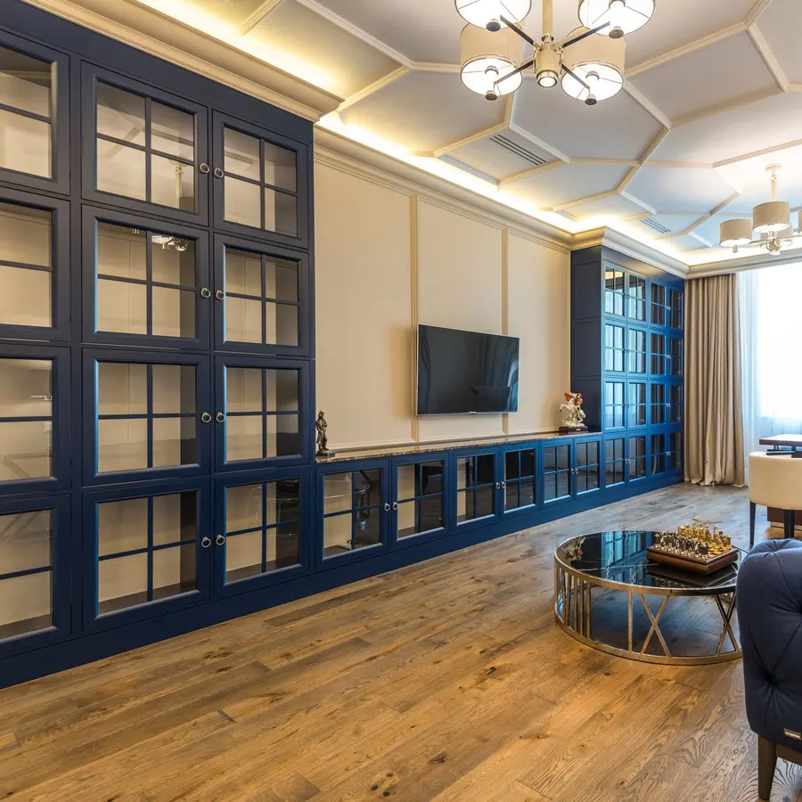 Elegant living and dining room with a coffered ceiling and wood floors