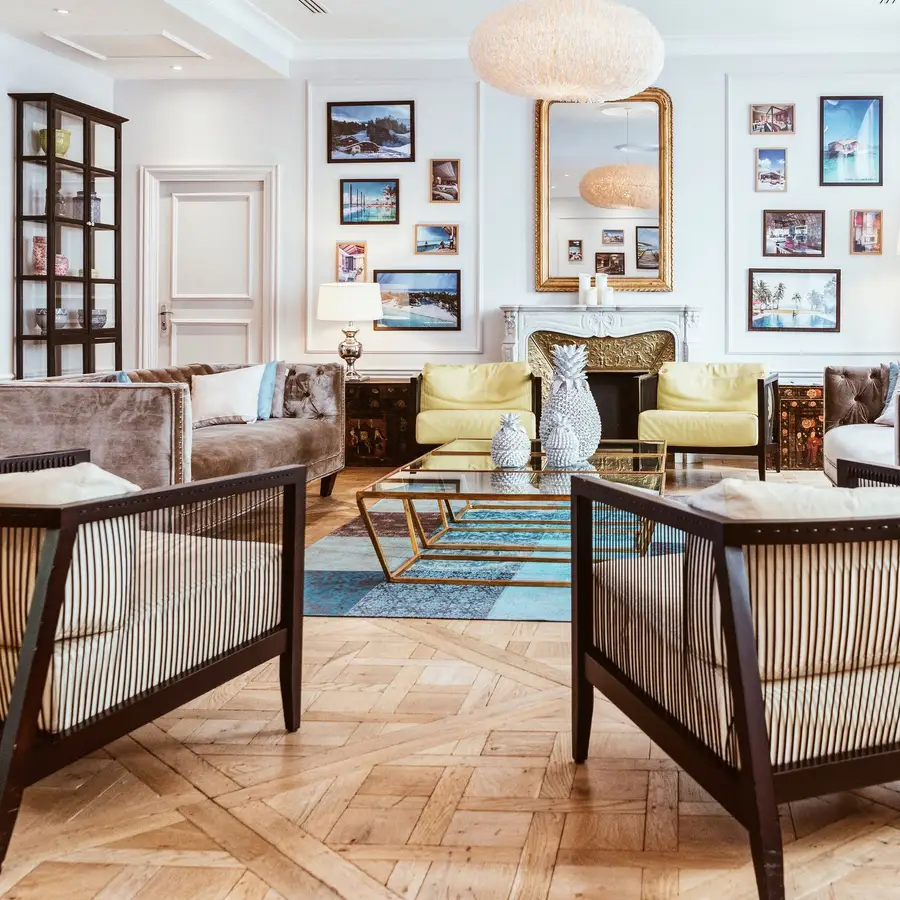 Elegant family room with wood floors, framed art and natural light